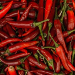 Close-up of vibrant red chili peppers showcasing texture and freshness.